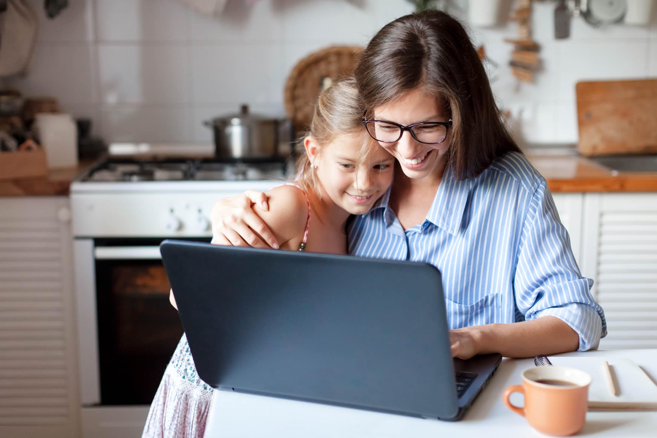 photo-of-mom-and-daughter-using-laptop-and-browsing-school-choice